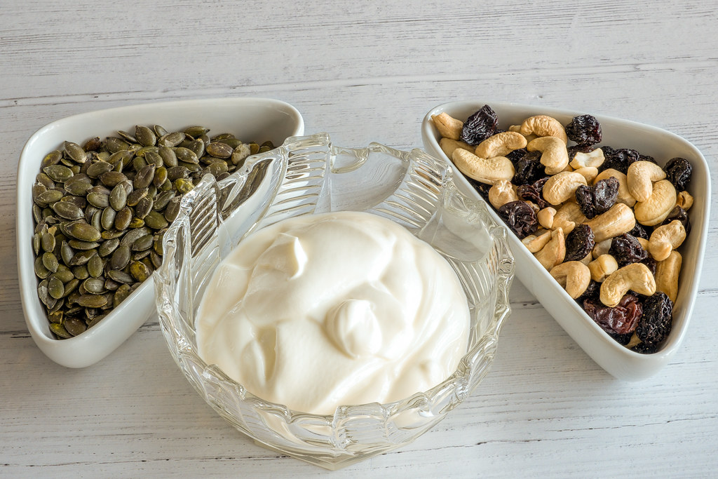 Greek Yogurt and Chia Breakfast Bowl with Berries ingredients and preparation setup